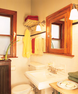 Vintage lighting and hardware honor the classic style of this bungalow, while modern amenities such as a tankless water heater increase energy efficiency.